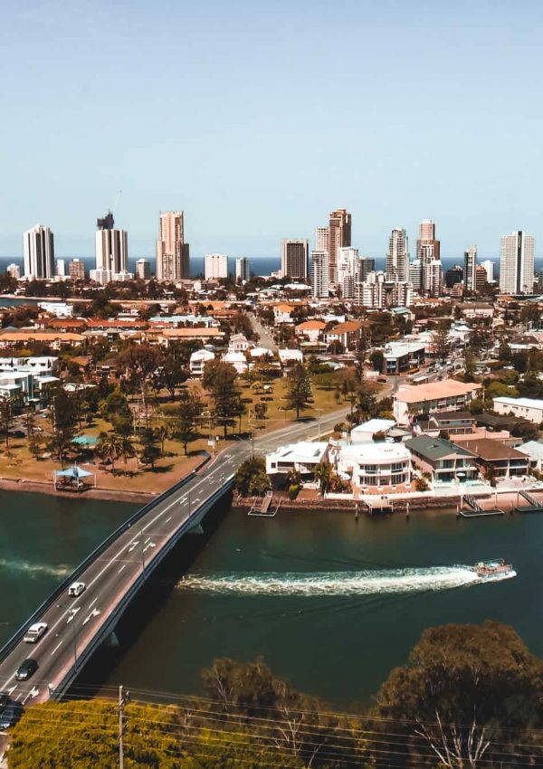 aerial view of a city, bridge over the river, high rise buildings in the distance- Gold Coast